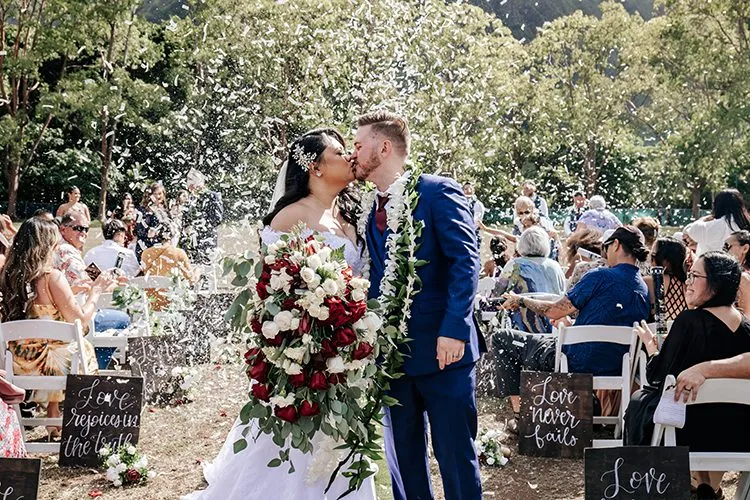 married couple kissing at their wedding