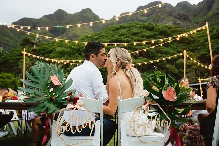 Wedding couple kissing at Kualoa Ranch