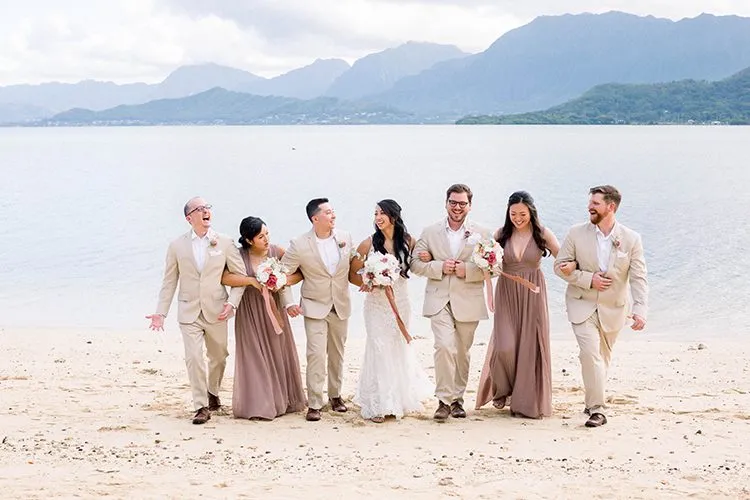 Bridal Party Taking Photo on Beach